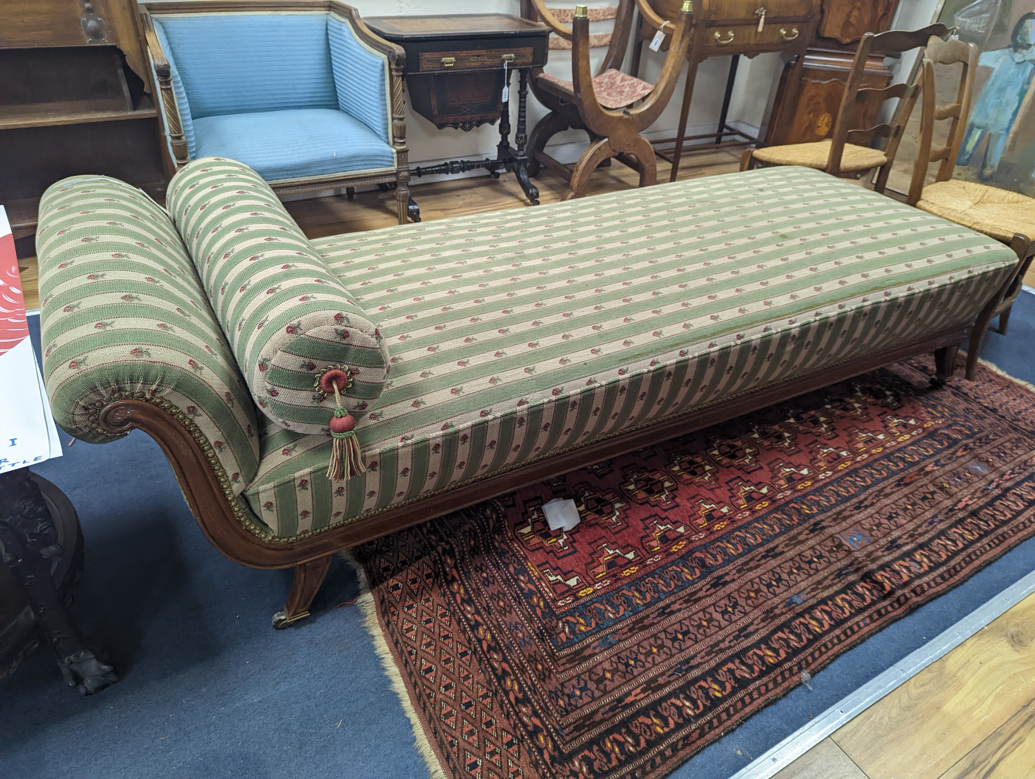 A 19th century Continental mahogany upholstered day bed, length 210cm, width 78cm, height 64cm